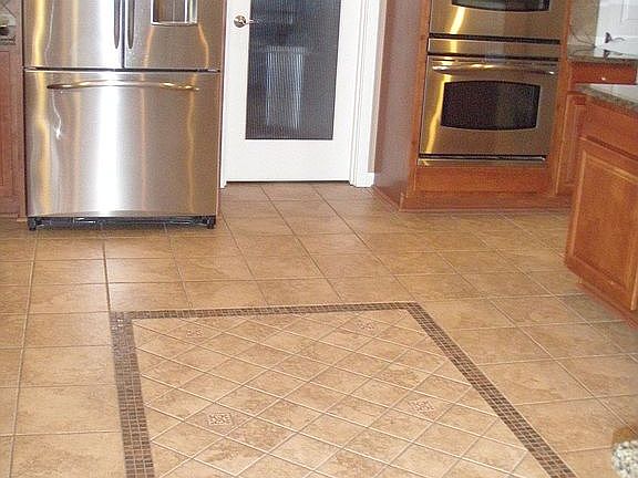 Kitchen with tile in lay