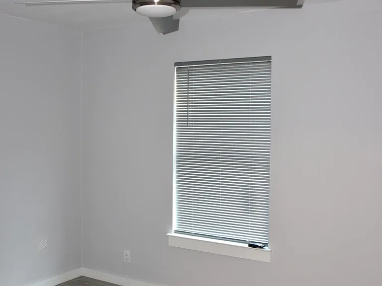 One of the bedrooms. Notice the stainless miniblinds.