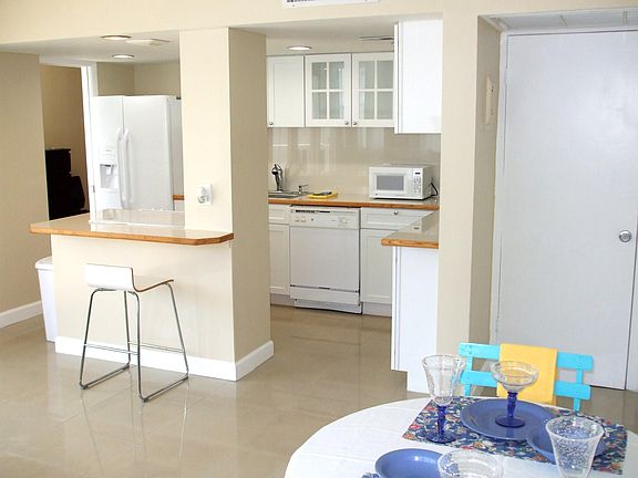 The open and remodeled Kitchen overlooks the Living / Dining areas.