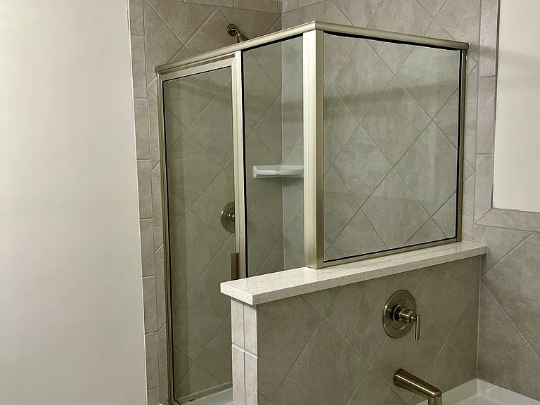 Master bathroom includes both tub and shower situated in a spacious area
