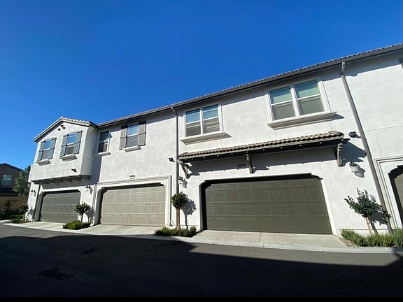 Furthest left garage & all the windows to the right are a part of the condo