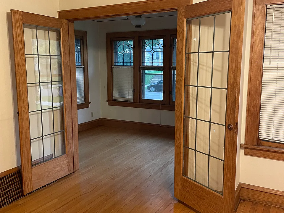 Sunroom has leaded French doors.