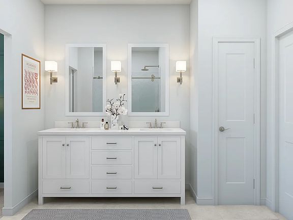 Primary bath featuring freestanding vanity with dual sinks