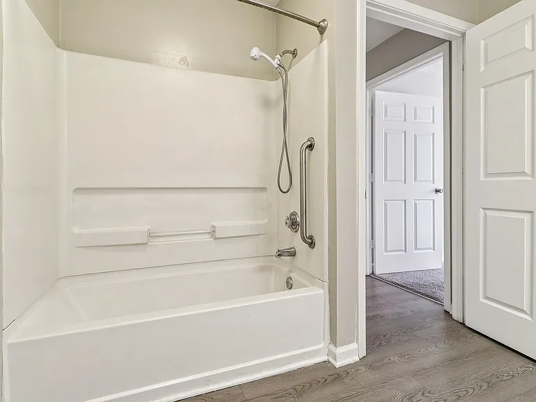 Refresh in bright bathrooms featuring full tub and shower combinations, professionally operated by Highlands Vista Group.