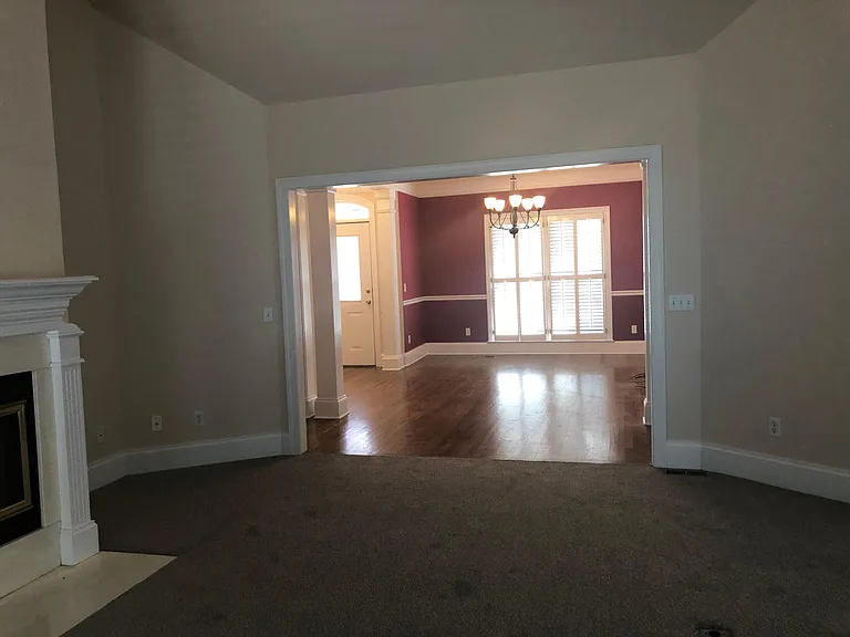 View from great room into dining room and front entry
