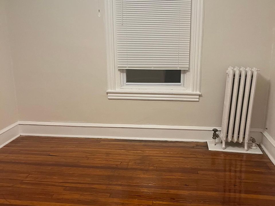 Smaller bedroom has one window and a small closet