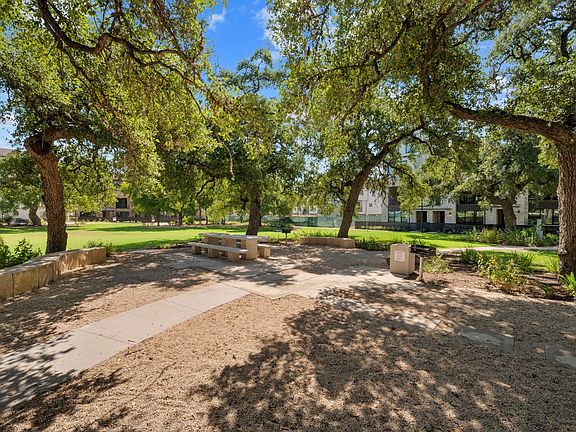 Park in front of home with grills and picnic area.