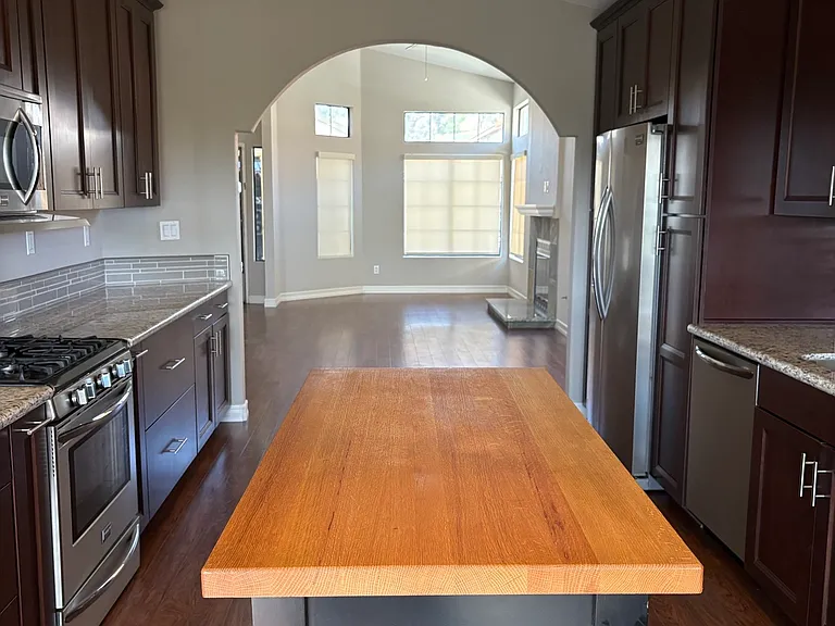 Kitchen with granite counters and rolling Boos Block Island.