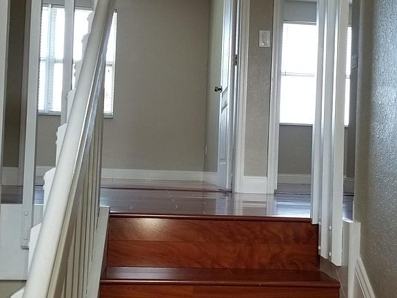 Top of stairs leading to 3 bedrooms