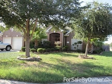 Front view of the house
						:
						House is on a nice size corner lot with beautiful landscaping.