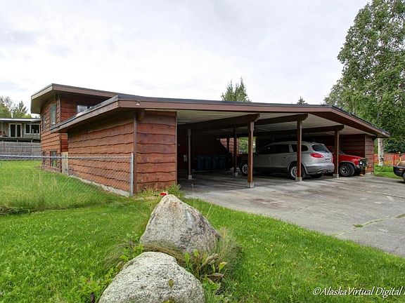 Carport enclosed on 3 sides with engine heater outlet