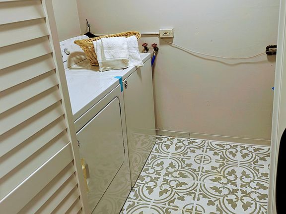 Fancy laundry room with new washer/dryer, mechancials and room for storage