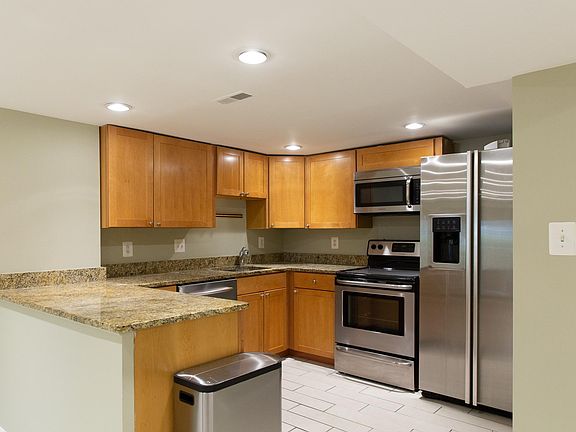 Kitchen with dishwasher, garbage disposal, and granite countertops.