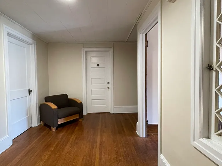 Apartment door to the left