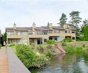 View from the backyard. Desirable end-unit condo