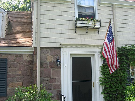 Front door, window boxes, brownstone front, super premium vinyl siding