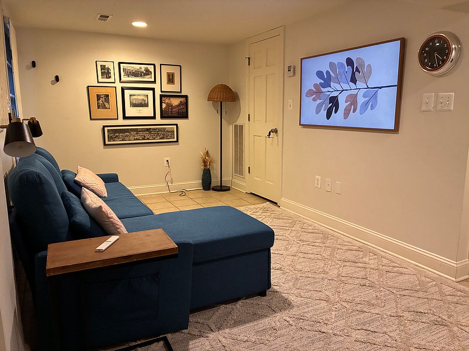 Living room with chaise sofa that converts to double bed.