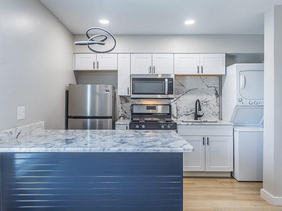 Experience culinary elegance in this sleek, modern kitchen.