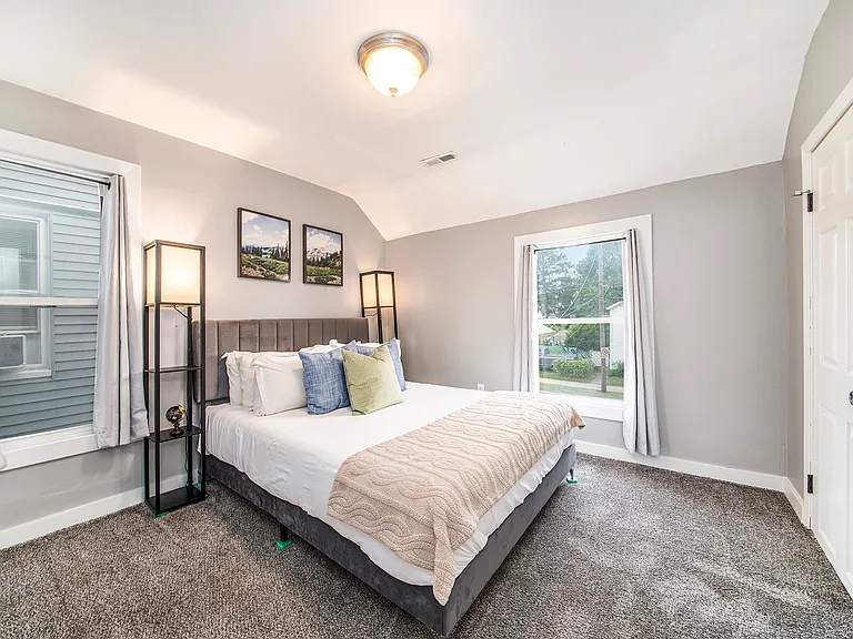 Queen size bed with nightstands and reading lights. BLACKOUT Curtains