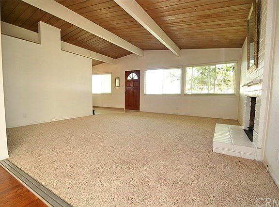 Spacious living room w/open-beamed ceilings