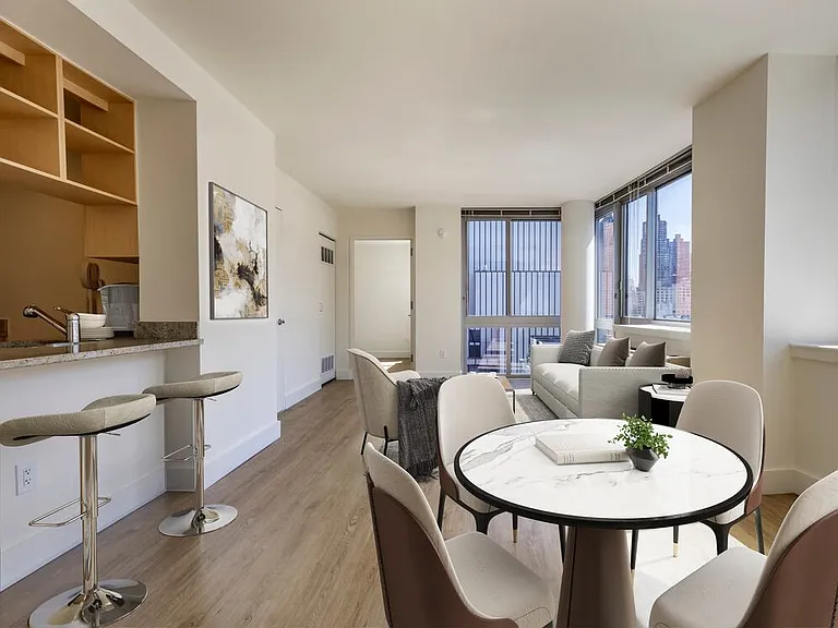 Renovated I South dining and living room with hard surface flooring