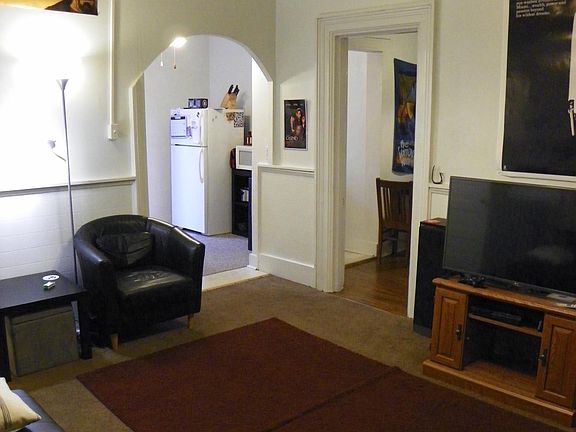 Living room looks toward kitchen & dining area
