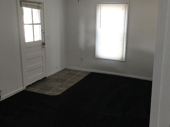 looking from dining to front door.  New front door no window