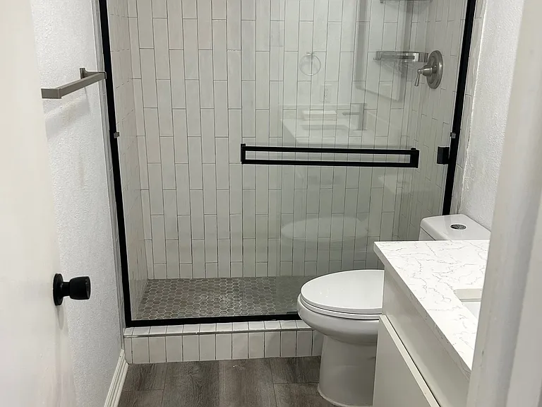 Main bathroom with glass enclosed shower