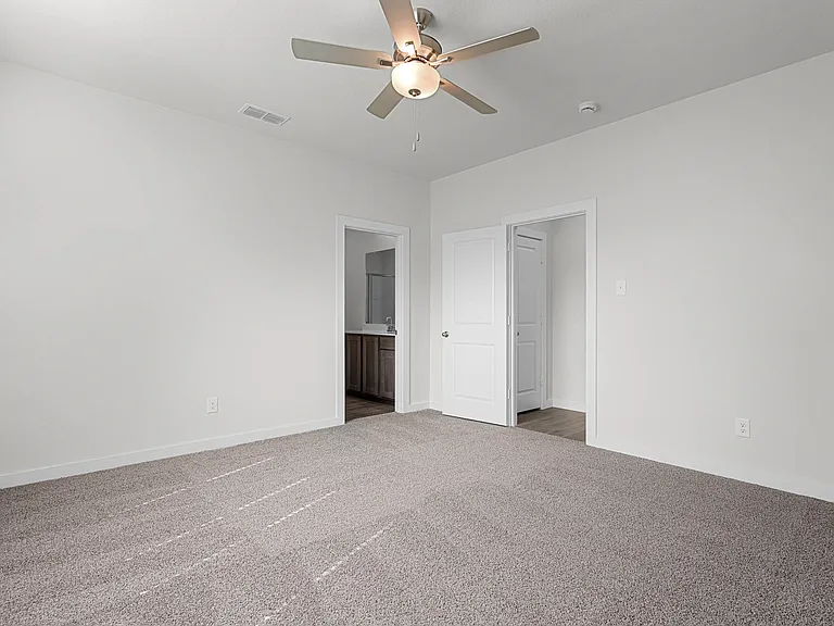 The master suite has a large bedroom, ensuite bathroom and a walk-in closet.