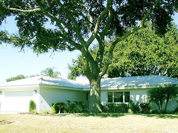 Front view beneath live oak trees
