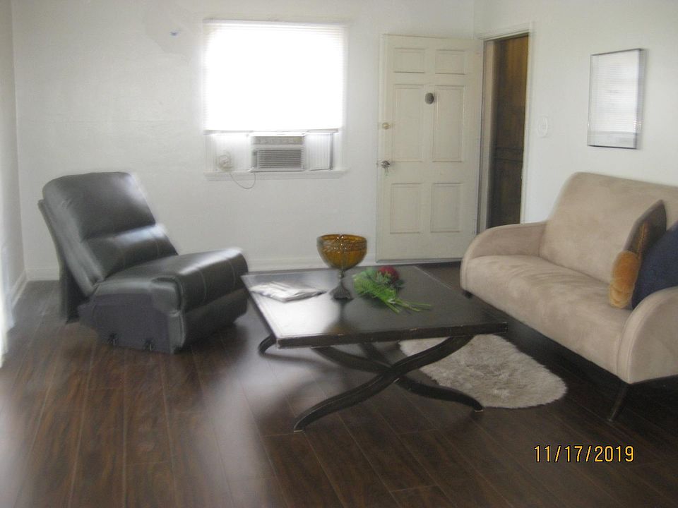 Living room and entry from hallway with your private security door