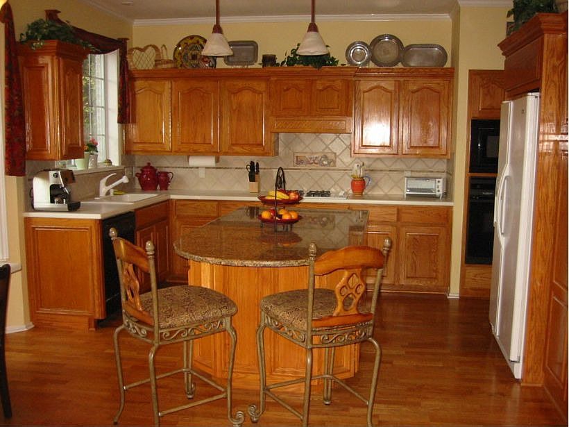 Custom kitchen cabinetry with large granite island.