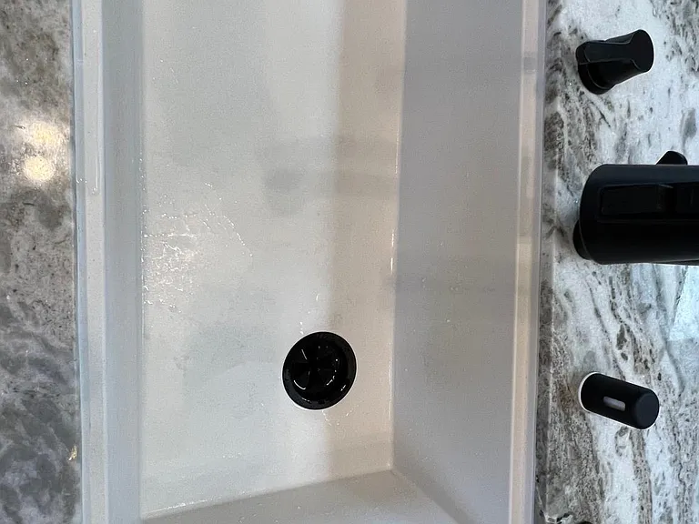 kitchen sink with hand pump for hand soap and dish soap, refill by putting tube pump straight into manufacturer bottle; no need to refill separate attached bottles