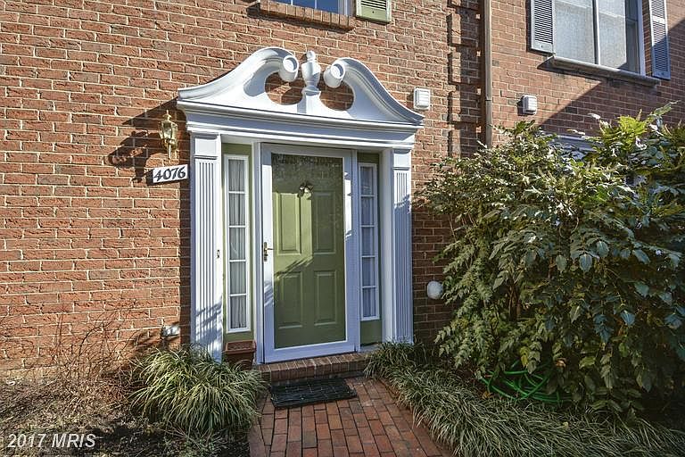 Main entrance nestled at the back of the courtyard sharing o