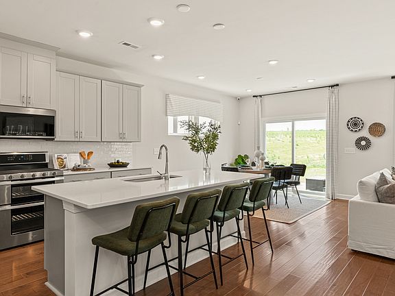Enjoy your morning coffee at the kitchen island. Photography from Simpson Farms in Charlotte.