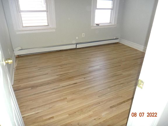 Spare bedroom 2 highlighting refinished floors