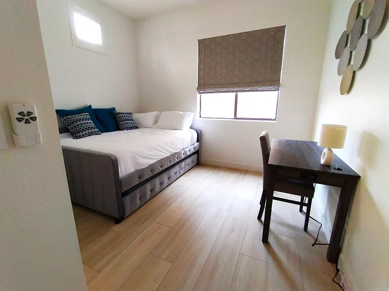 Queen daybed in second bedroom. Trundle pulls out with twin mattress.