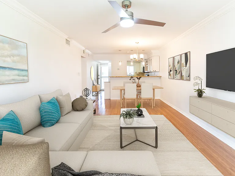 Bamboo flooring throughout the condo with modern lights and ceiling fans in every room on the second floor.