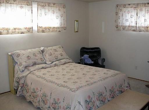Master bedroom w/private half bath; hardwood floors under carpet in bedrooms.