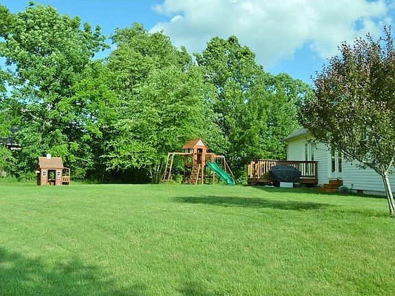 Terrific green tree lined back yard. Room for kids, pets & play of all kinds. Rear deck for cook outs.