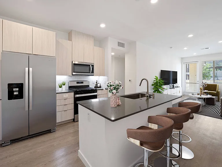 Indulge in gourmet chef-inspired kitchens, featuring sleek quartz countertops and a luxurious island for the ultimate cooking experience.
