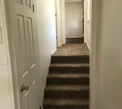 steps and hallway to bedrooms