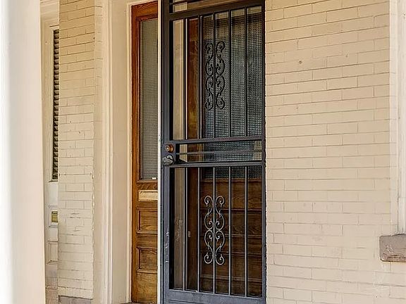 Front Door Entrance & Porch _ A cozy front porch and inviting entryway that sets the tone for this warm and welcoming home.