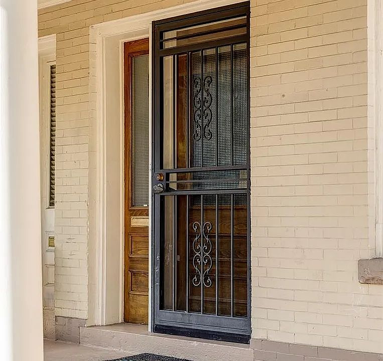 Front Door Entrance & Porch _ A cozy front porch and inviting entryway that sets the tone for this warm and welcoming home.
