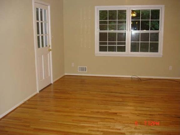 Expansive family/greatroom w/hardwood floors and fireplace