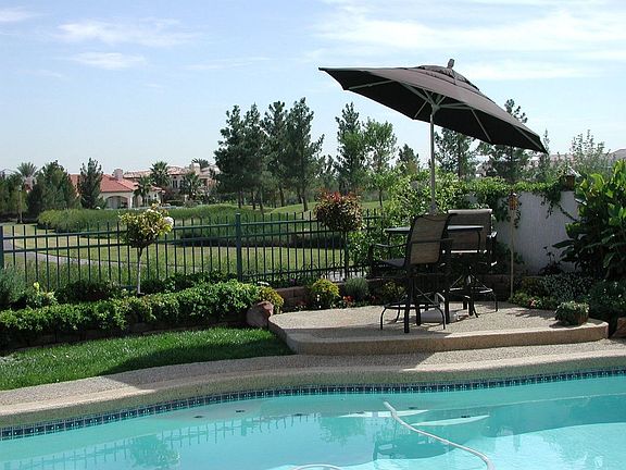 Mature landscaping and golf course view