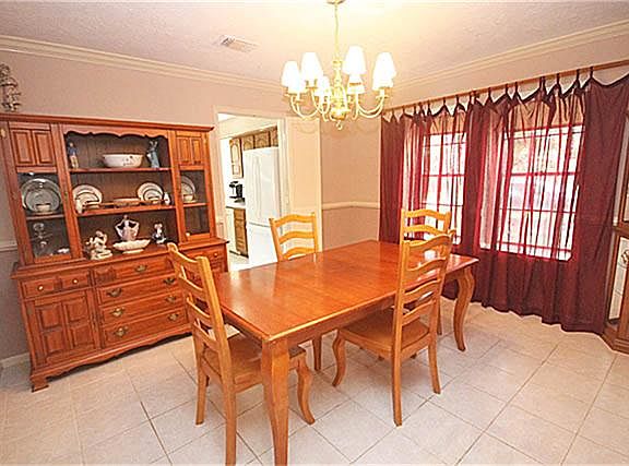 Step through the front doors and be greeted by this lovely formal dining room.