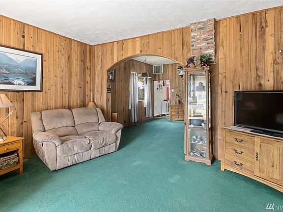 Spacious living room is open to the entry and dining room.