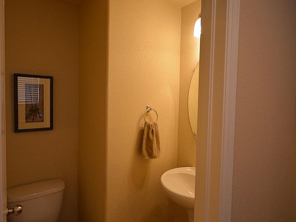 Guest powder room near kitchen and menu planning area