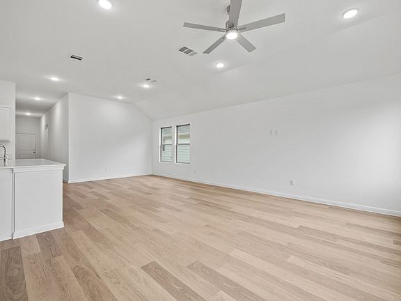 Living and Dining Area in the Quartz home plan by Trophy Signature Homes - REPRESENTATIVE PHOTO
